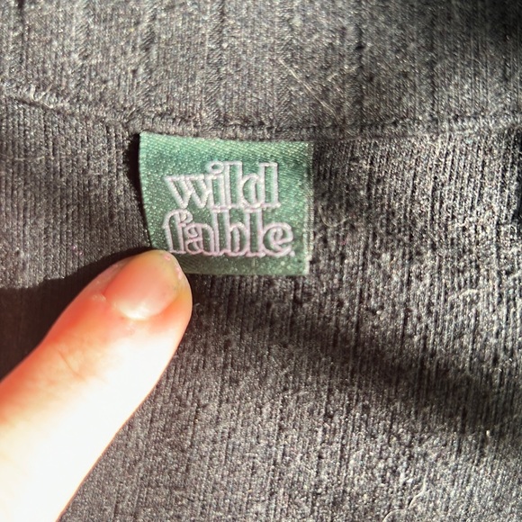 Black short sleeve and pant onesie romper with a button up front. - Picture 5 of 6